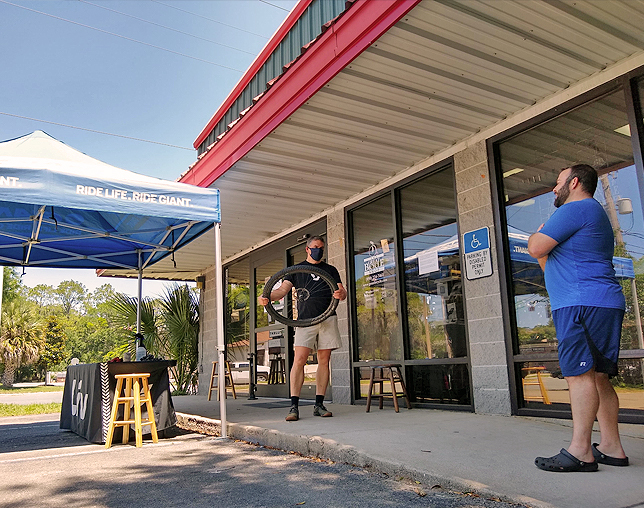 At The Great Bicycle Shop, customers are attended to under the shade of the front awning in addition to a couple pop-up tents.